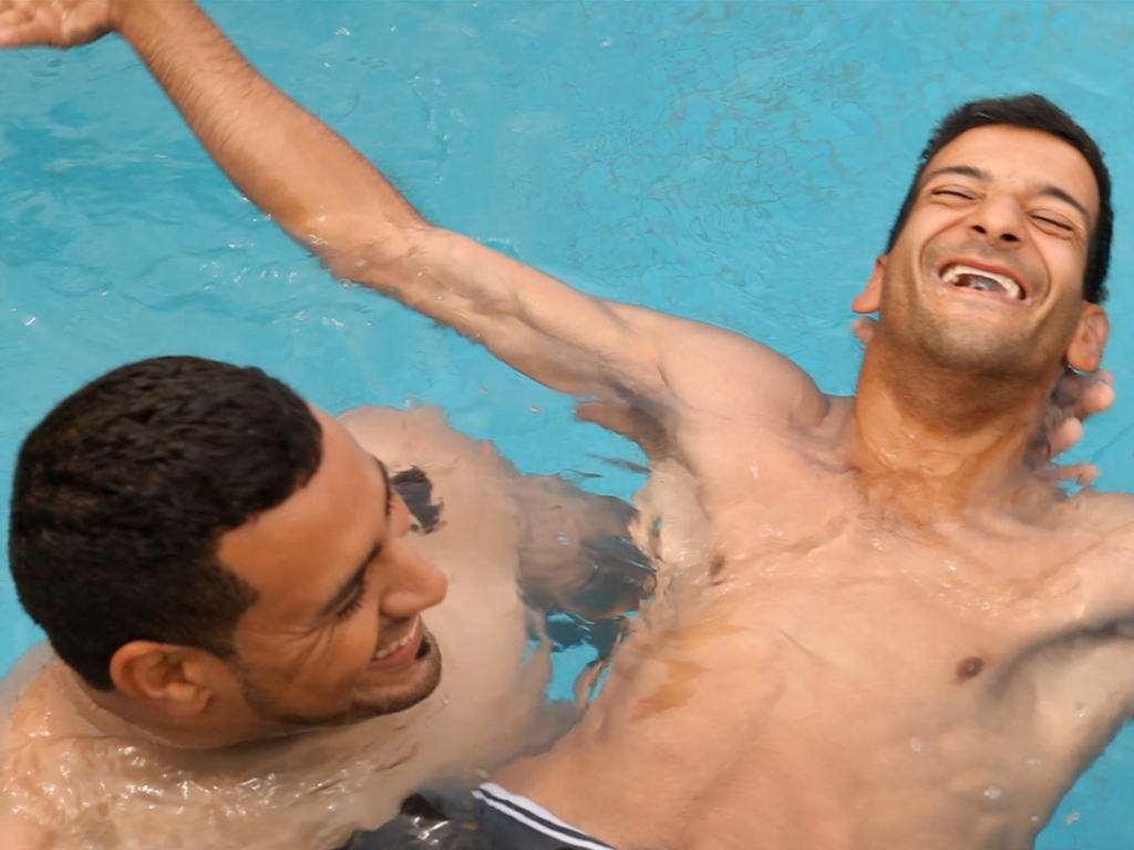 Azzedine teaching Youssef to swim