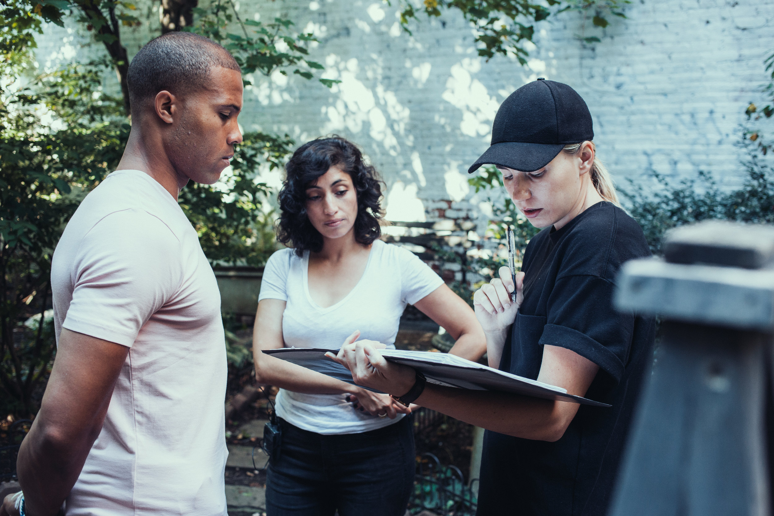 Actors Anthony T Solano (LEFT) and Alba Ponce De León rehearsing lines with Director Jess Dunn (RIGHT).