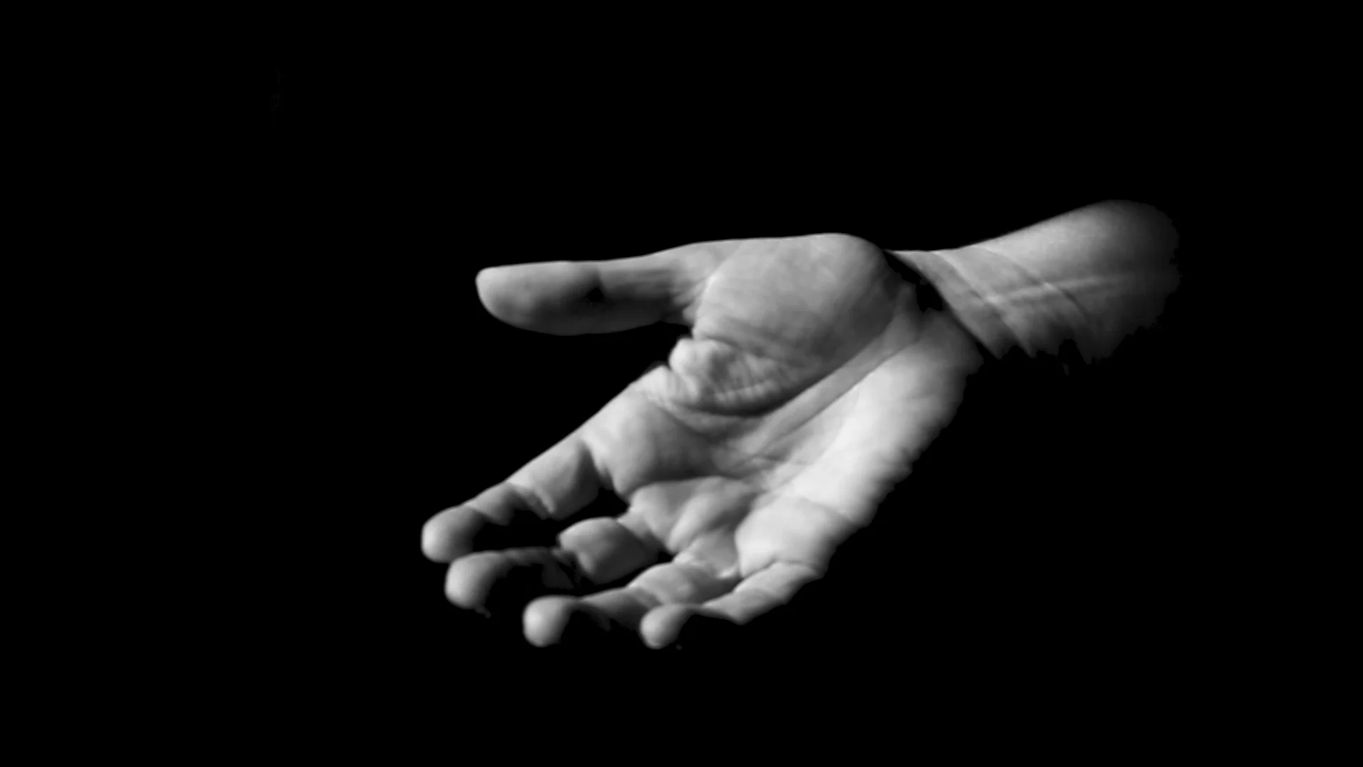 Zeljka’s hand reaches out to accept a sweet given out by an UNPROFOR soldier. (re-enactment).