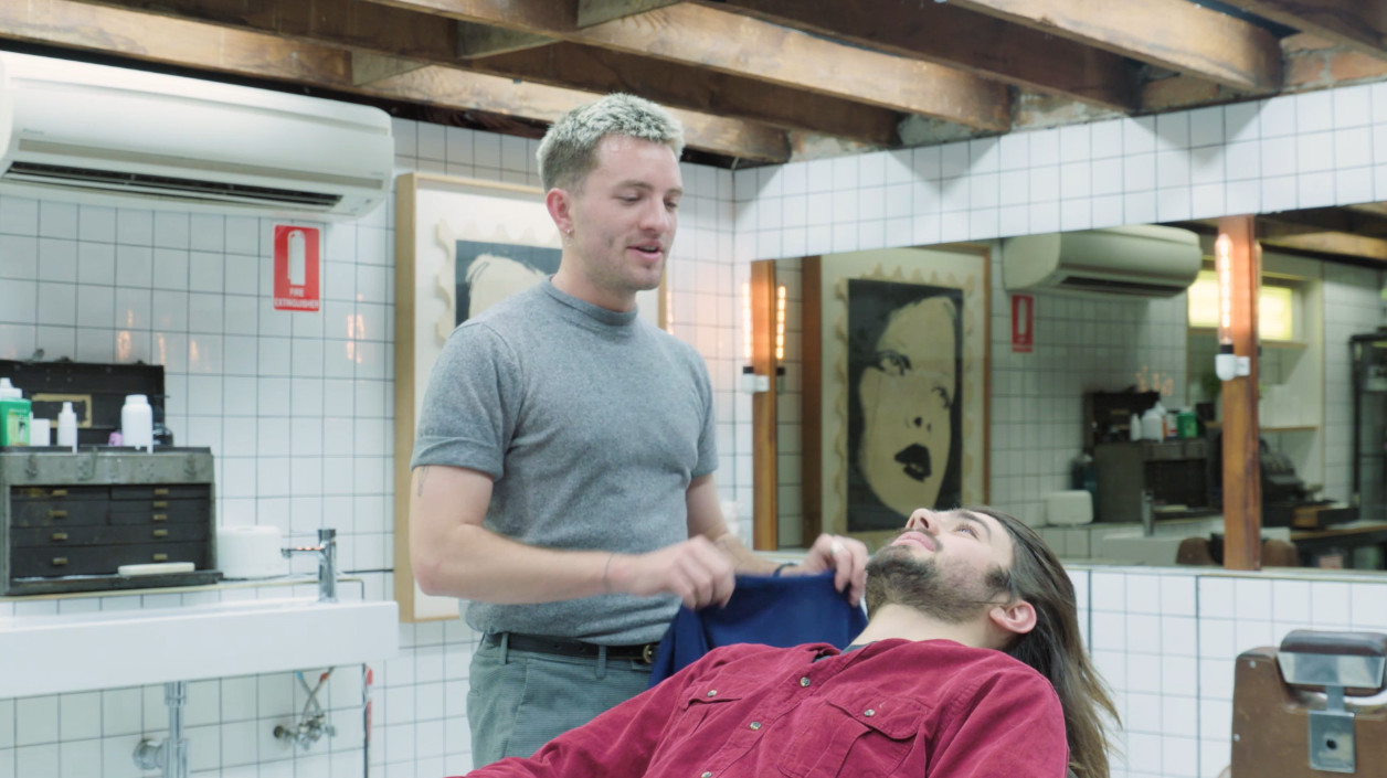 Benign Girl shaving Hugo before his big night at Drunken Barber.
