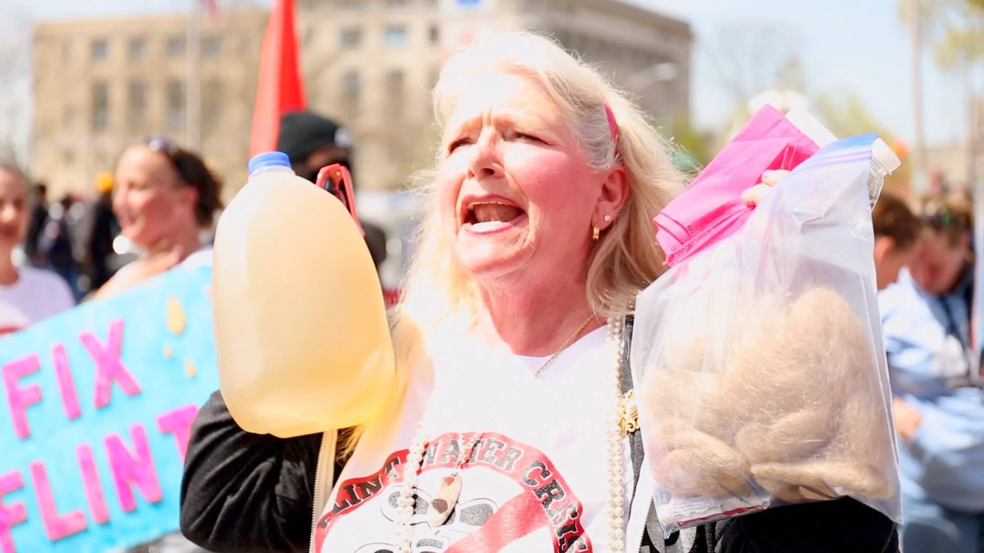 'Water is Life' at Standing Rock, Ojibwe water carrier Mary Lyons, Flint resident with her bag of hair and dirty water, Nayyirah Shariff leads Flint protest.