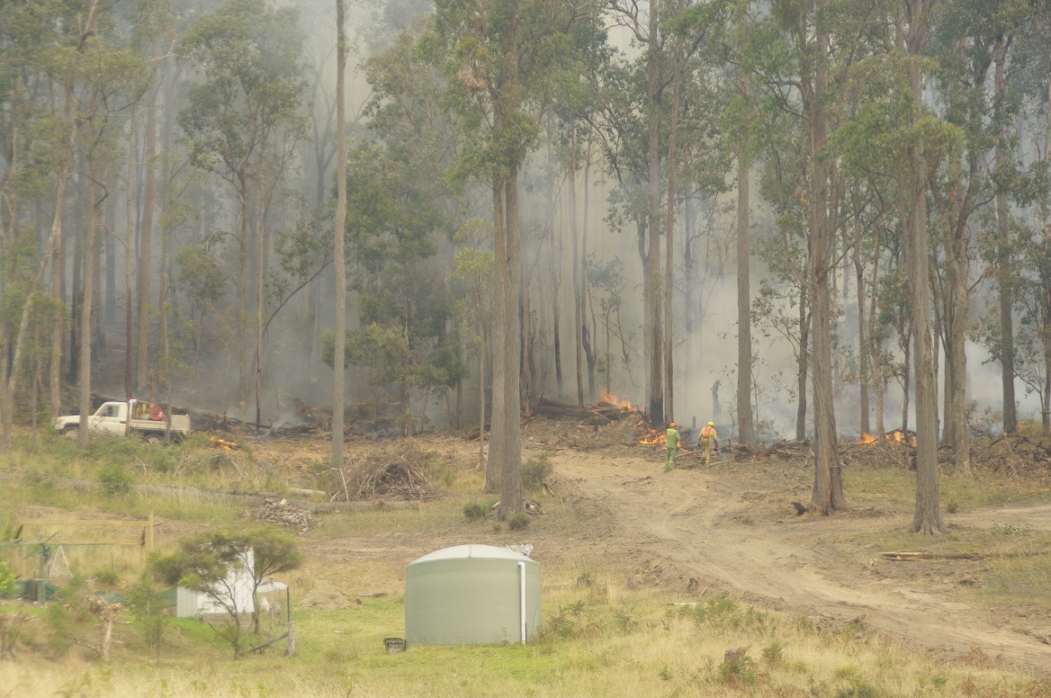 The fires were inches from her house