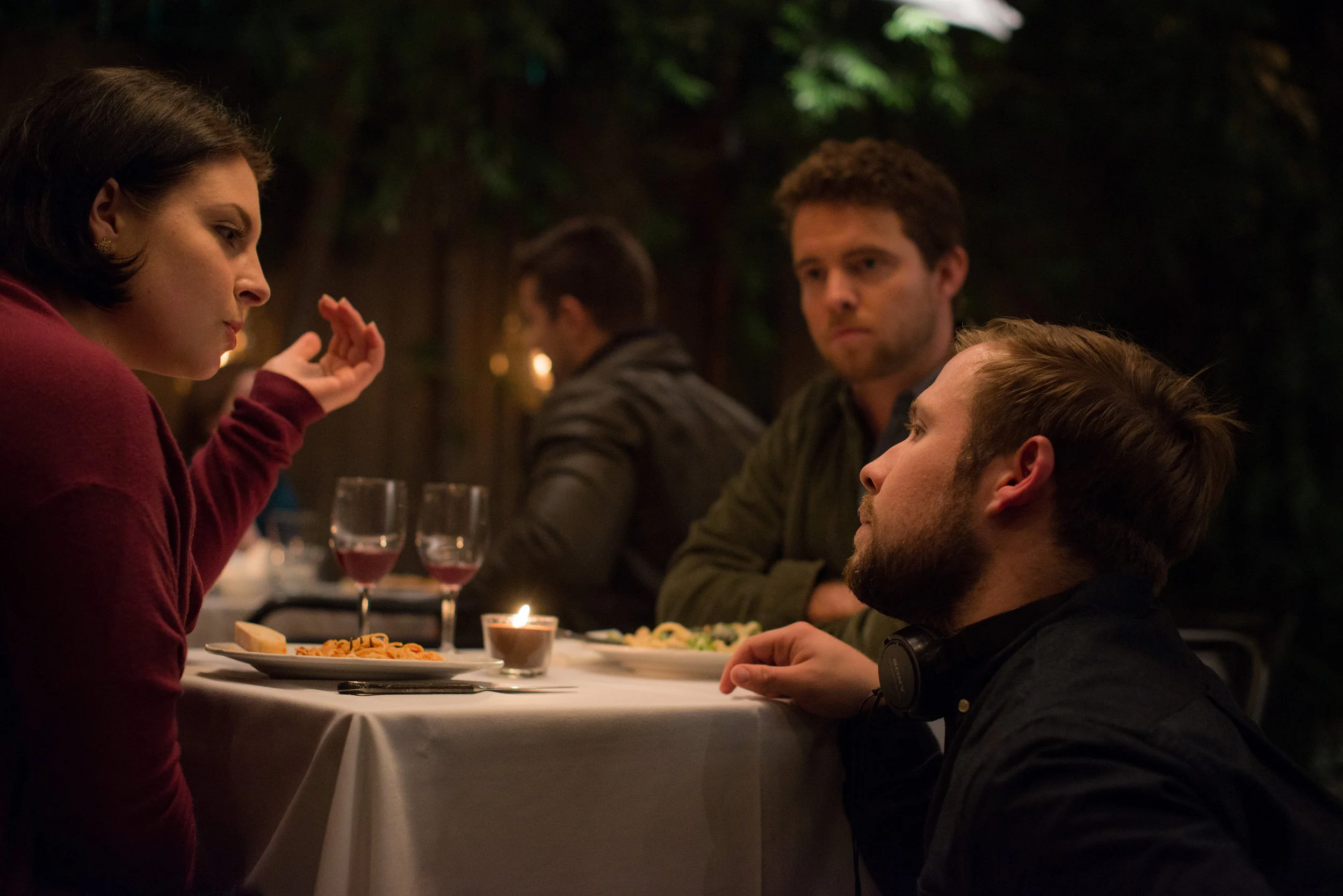 Director Brian White speaking with Producer/writer/actor Paulina Lagudi and Tim Fox on set.