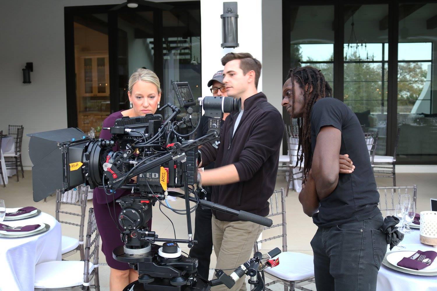 Behind the scenes of Guest of Honor - director/DP/AD: reviewing footage