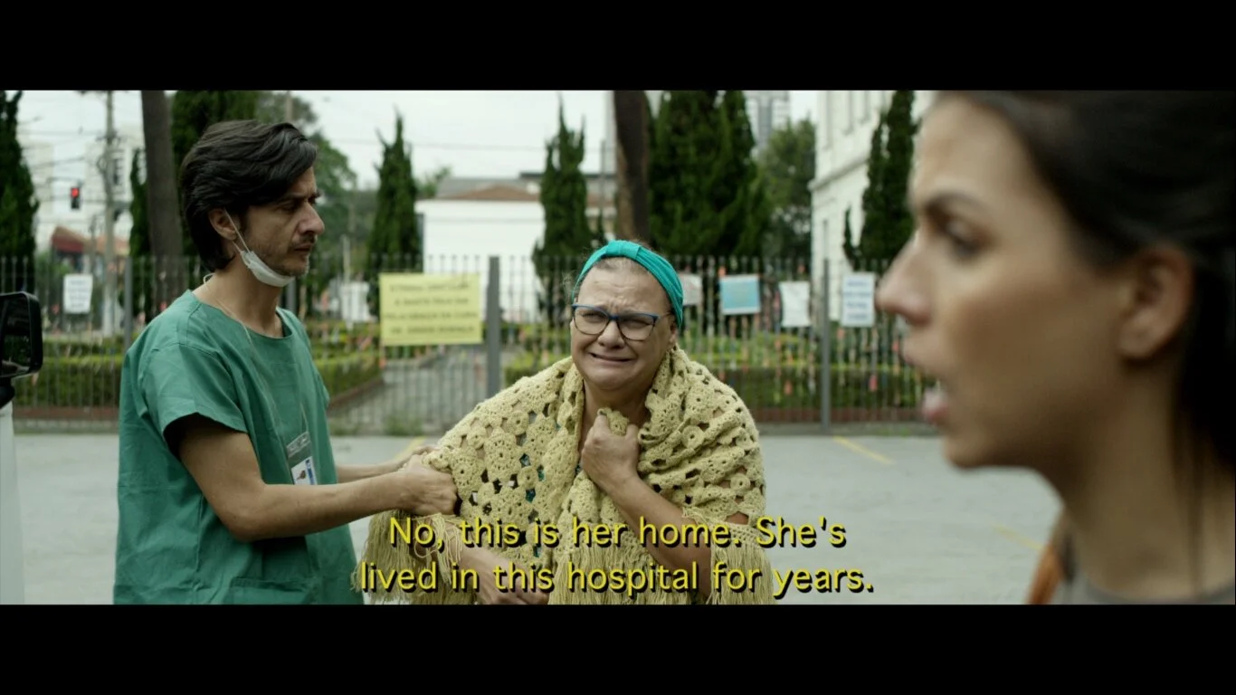 Social worker takes Lola (Cristiane Natale) away from the hospital where she's lived her whole life.