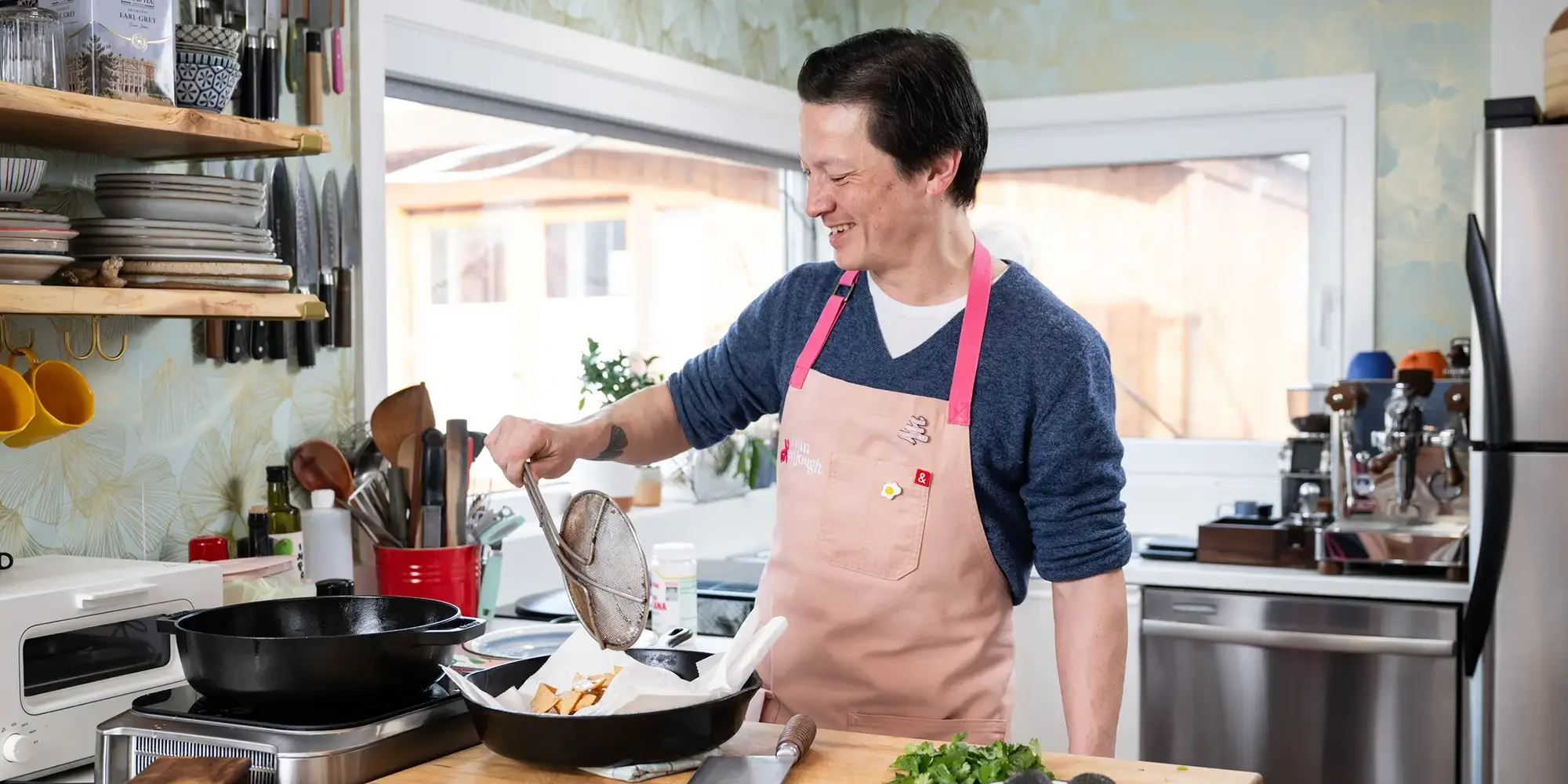 Kenji López-Alt cooking in his home kitchen