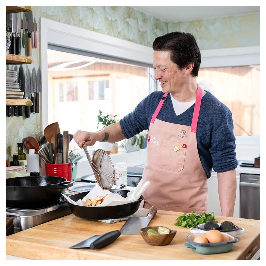 Kenji Lopez-Alt having fun while frying food in his kitchen