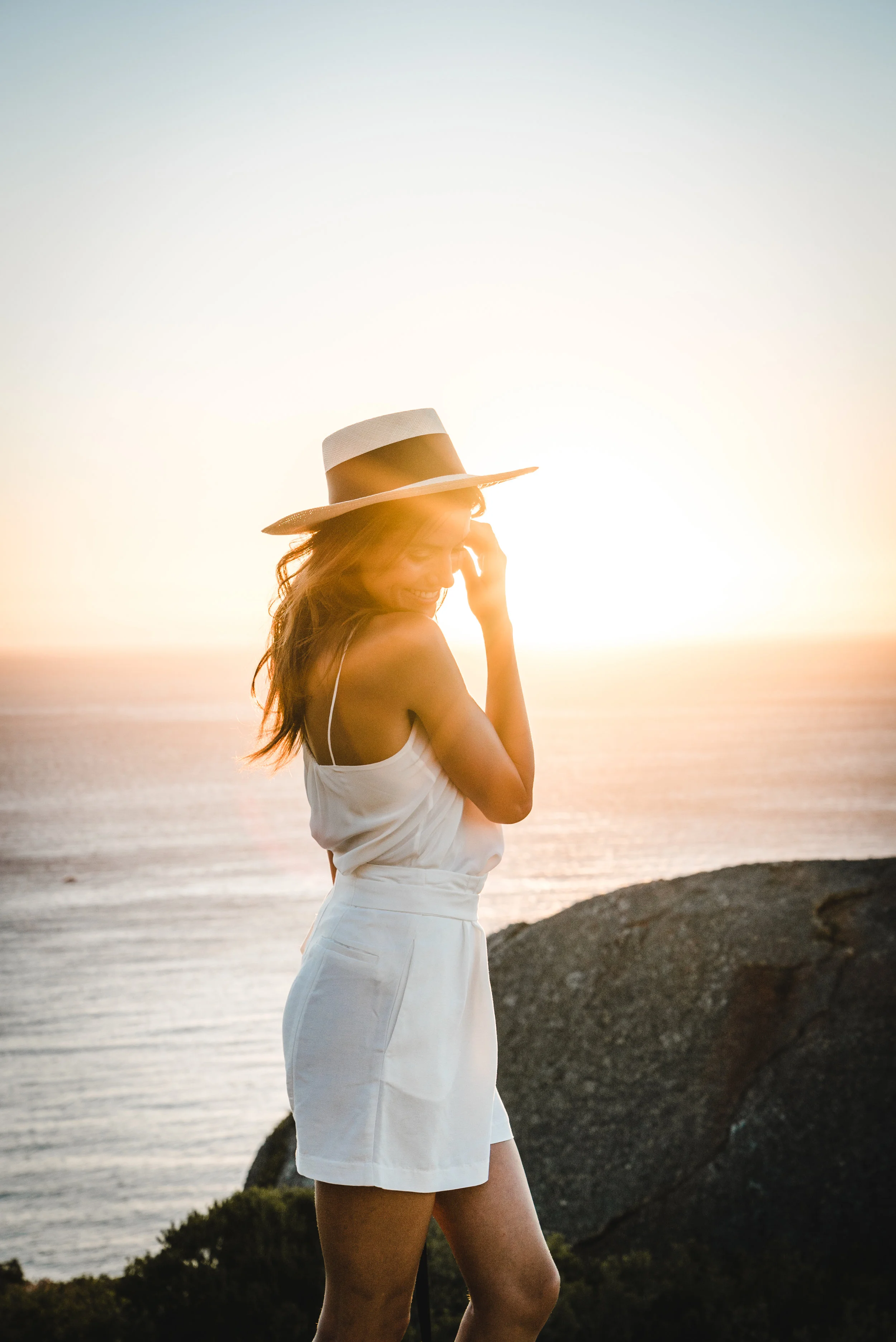 A girl admiring the sunset view from Signal Hill in Cape Town