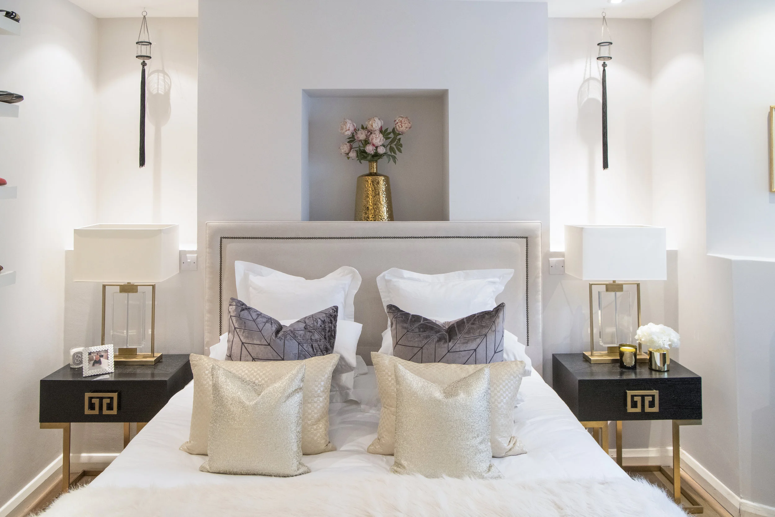 In the Master Bedroom, bed, bedside tables and lamps from the Yohan May Boutique . Cushions made with a Missoni Home fabric. Candle from Cire Trudon .