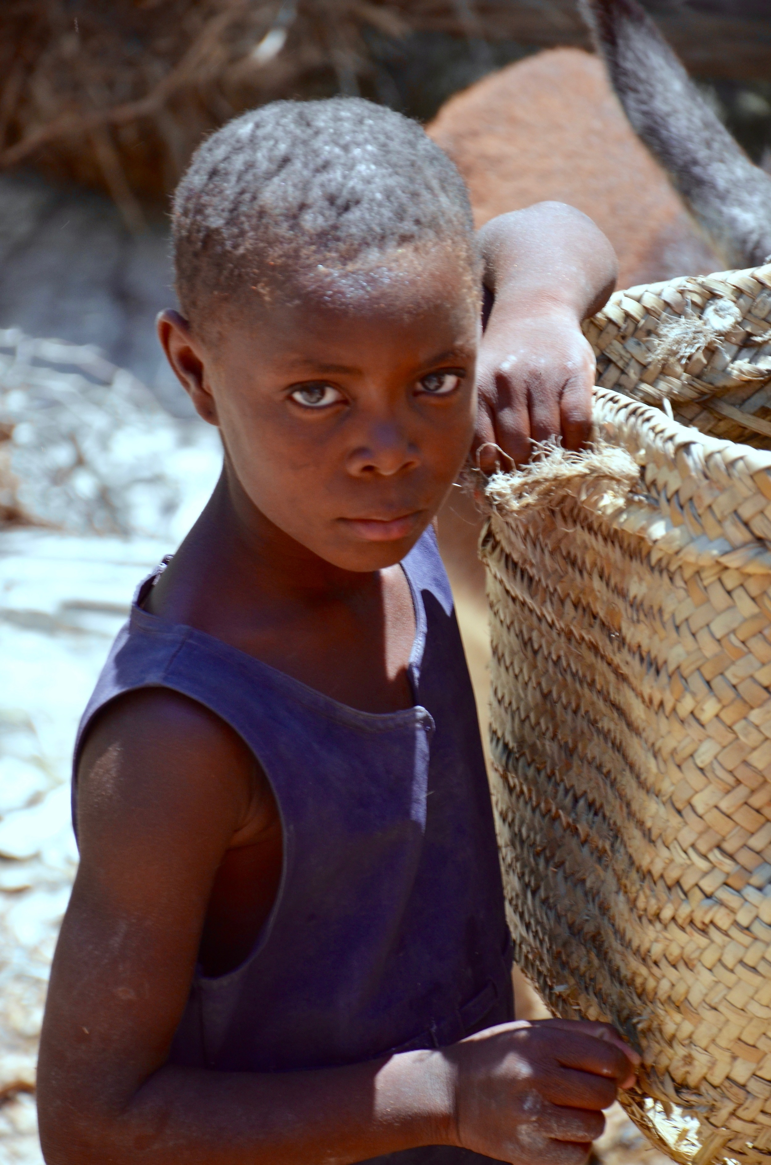 Terre Des Negres- We came upon this girl who was working hard with her older brothers near a water source. She was not part of the Lidè program. Kathryn asked her if she wanted to join the program. Her brother, not letting her answer, said that she has to work and there isn't time for her to do "those kind of things". She was loading jugs of water onto the back of a weary donkey. 