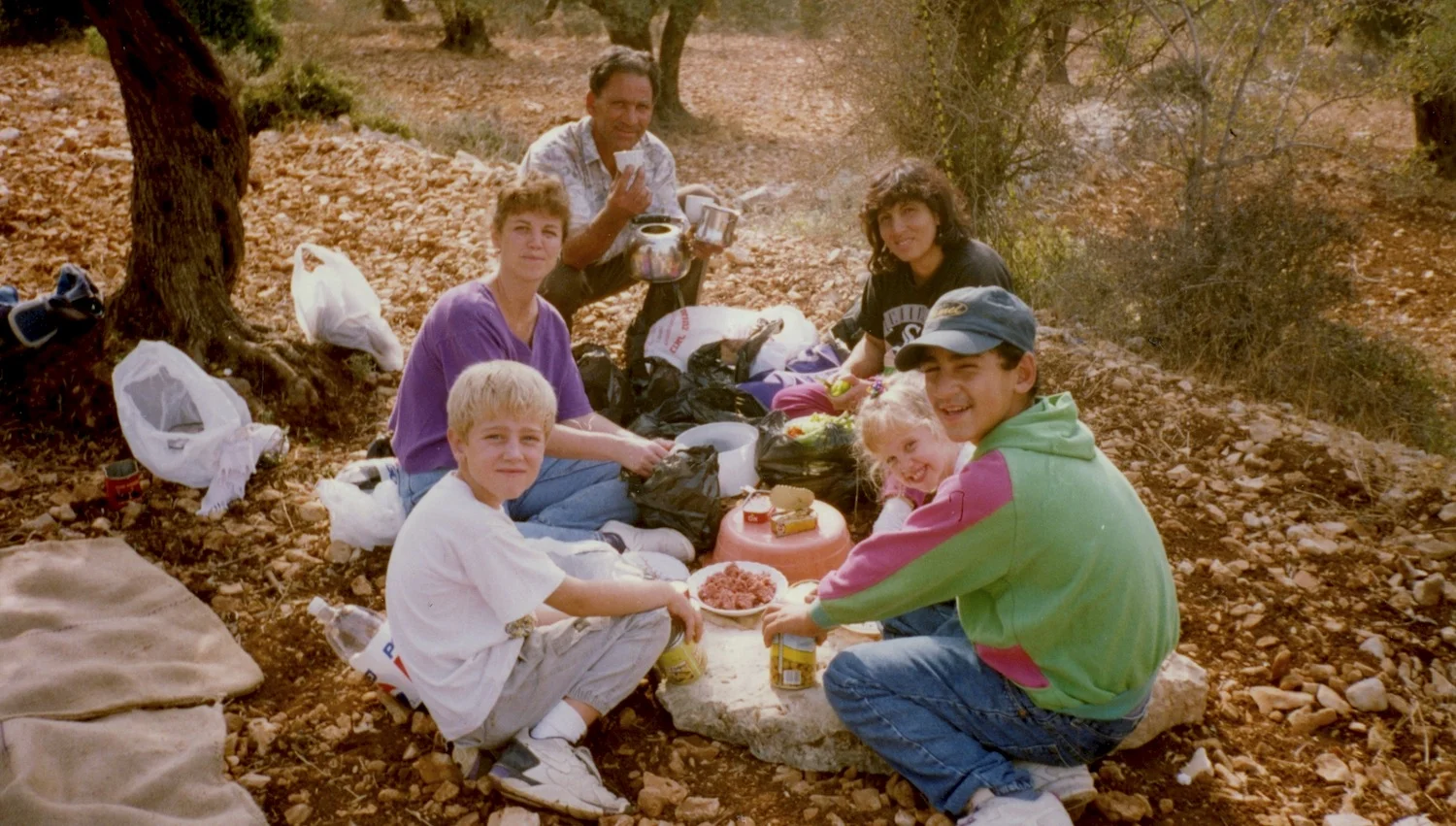 Family picnic shared with dear friends. Olive harvest, Birzeit, Palestine, 1996.