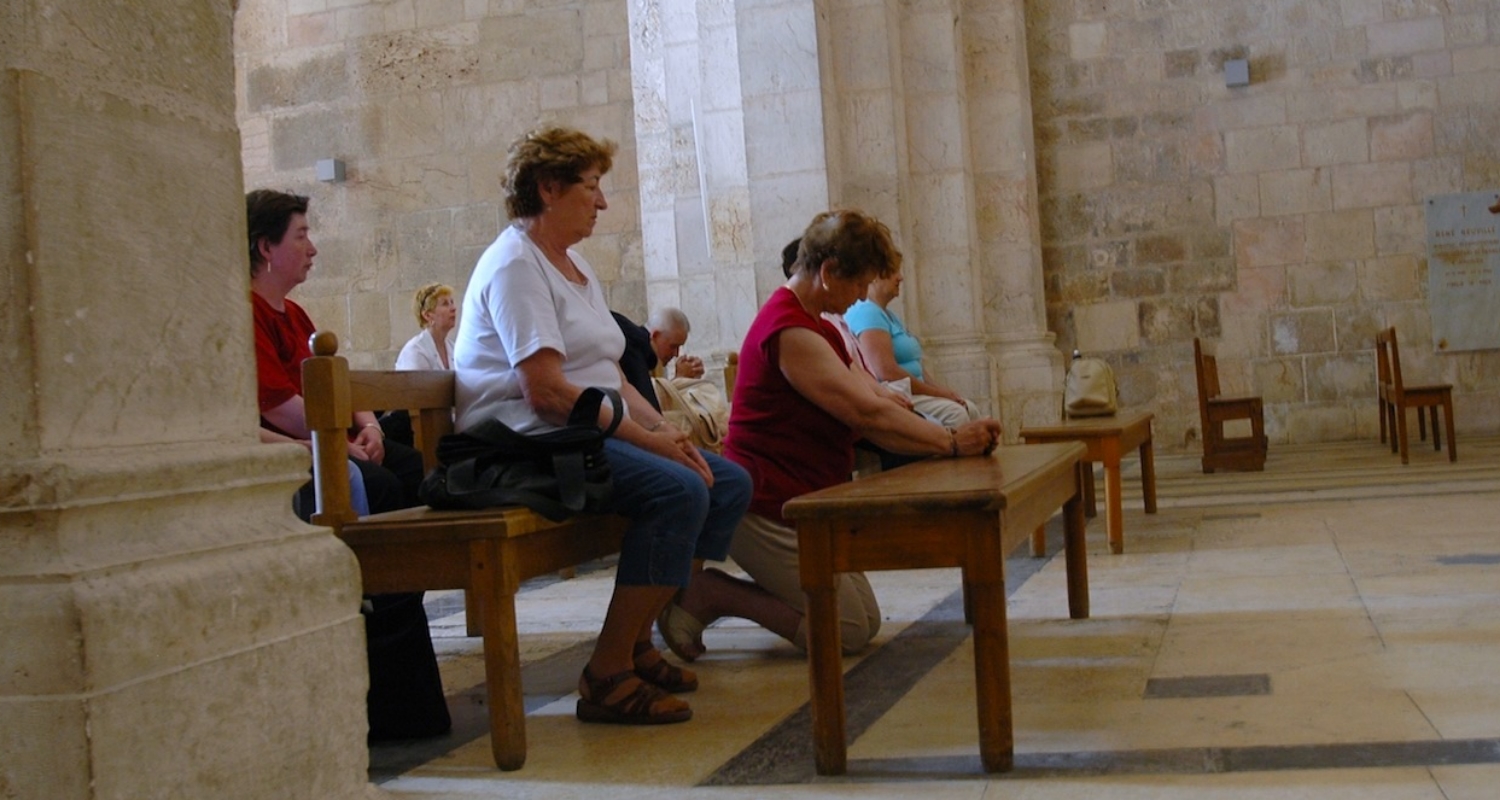 Worshippers in the Crusader-era Church of St Anne, Jerusalem. Photograph by Mark Ziese.