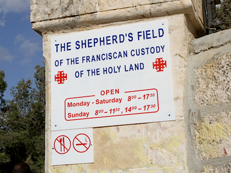 The sign outside the entrance gate. Above the entrance is a arch bearing the words “Gloria in excelsis deo.”