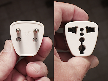 Plug adapter. On left, the pegs go into the “Screamer” outlet. On right, your appliance plugs in here.