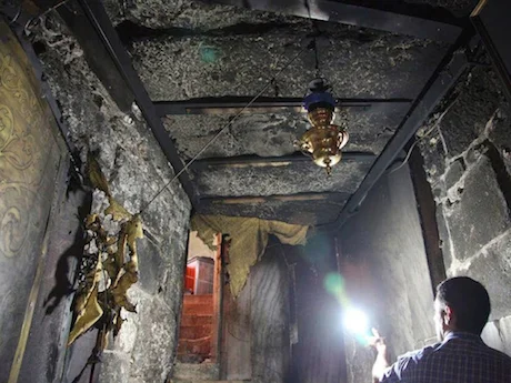 The damage in the grotto. Image from here .
