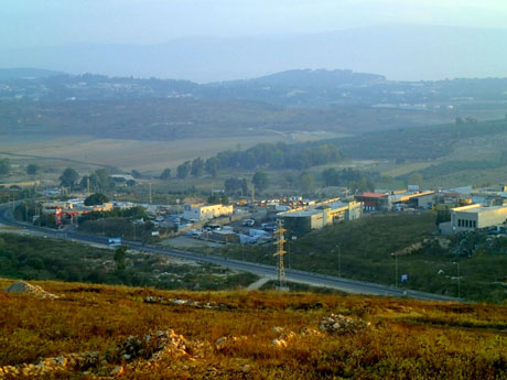 View to the area of Suffuriyyah (center horizon) and the gas station (left, along road). The wall of Upper Galilee rises faintly in the distance .