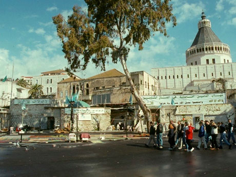This view to the proposed mosque site was shot approximately two months before Pope John Paul’s visit in the year 2000. Note the banners, flags, dome, and carpets.