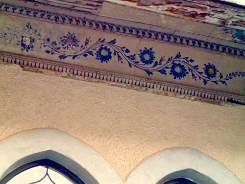 Detail of some of the painted decoration under the balcony’s eave.