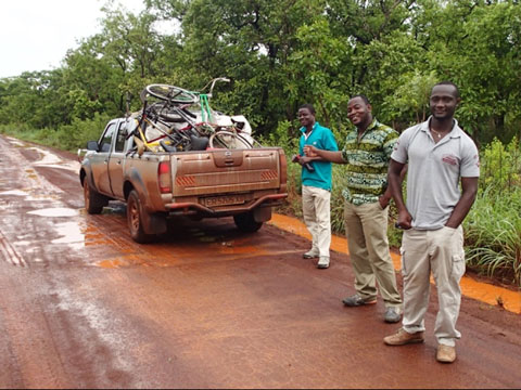 James, Austin, Isaac, and our loaded truck (right to left). Even a major highway like this one can be challenging in the rainy season.