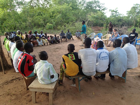 Isaac speaks to a gathering in Pulgnado. We are welcomed by the village elders (sitting just beyond Isaac).