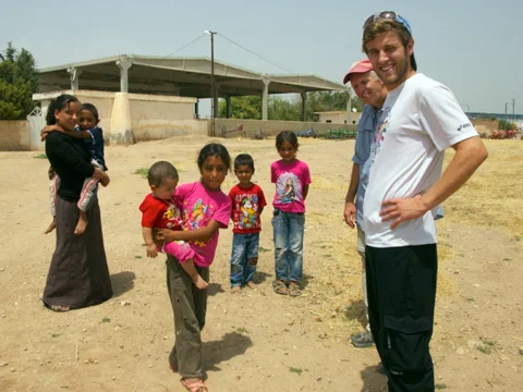 Tanner, Keith, and the village kids.