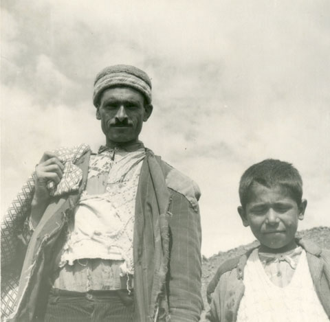 Locals at the base of the mountain. Note the tattered coats (From the Patterson Collection).