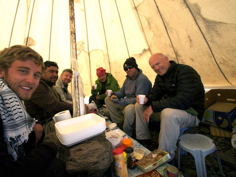 Elegant dining at 13,650 feet. From left to right: Tanner, Alcan, Greg, Uraz, Tommy, and Wilkerson. Note the boulder used as a table.