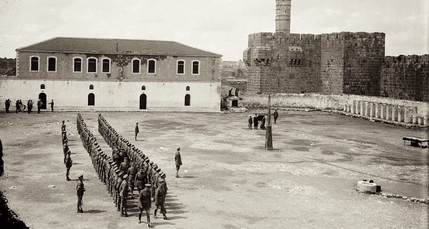 Soldiers in Barracks Square on 19 March 1918. This image clearly shows the Kishle as a two story building with a tiled roof. Note its position just south of the “Tower of David.” Image from here .