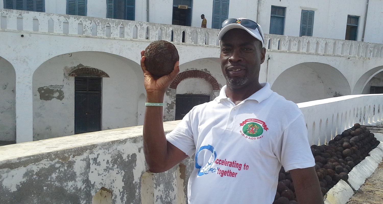 Edem thinks about launching a canon ball at Cape Coast Castle.