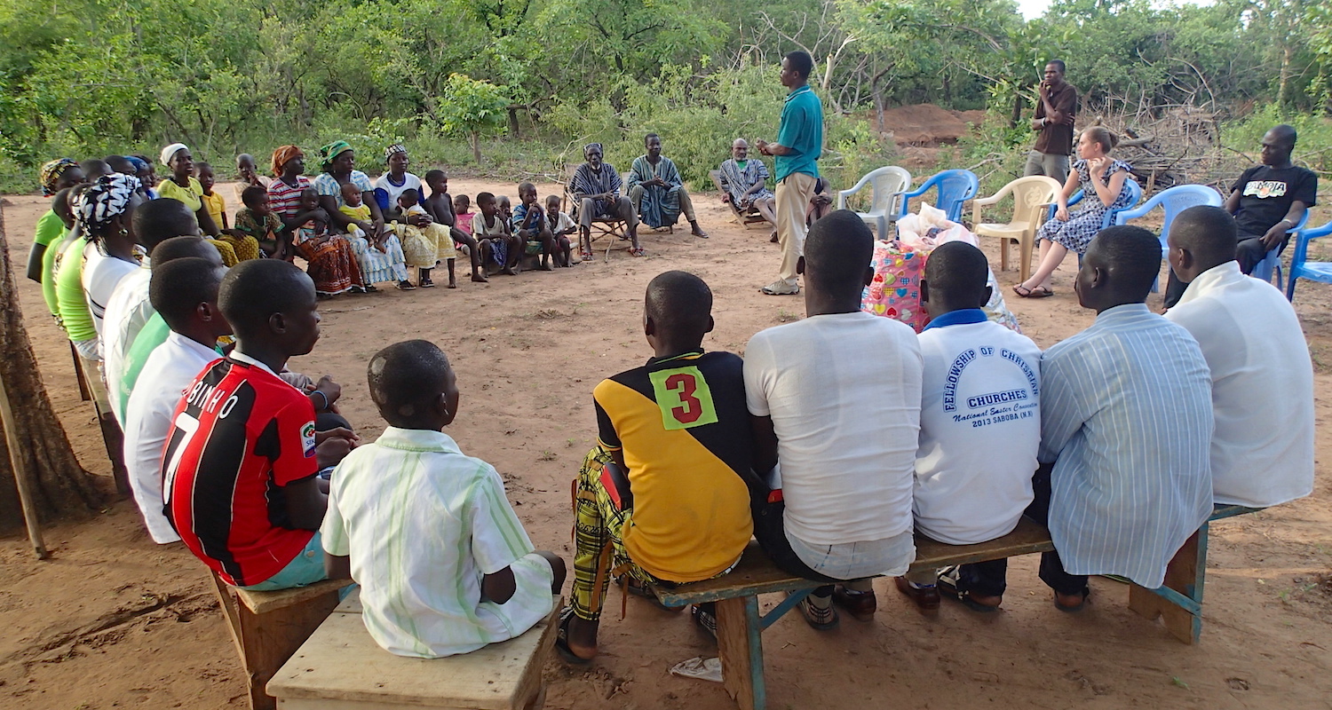 Isaac speaks to a gathering of believers in Pulgnando.