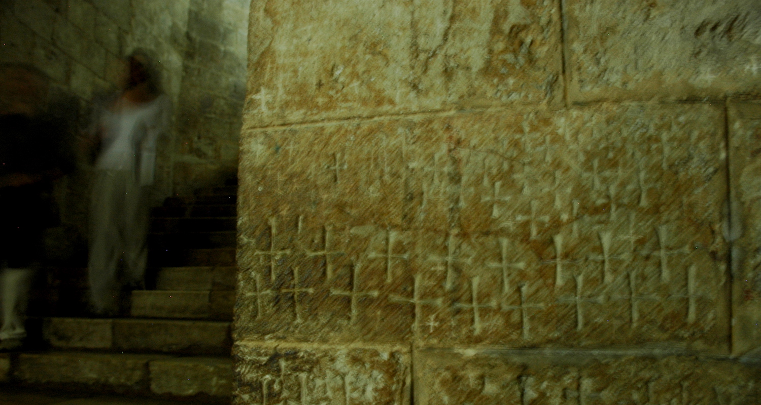 Carved crosses along the stair walls.