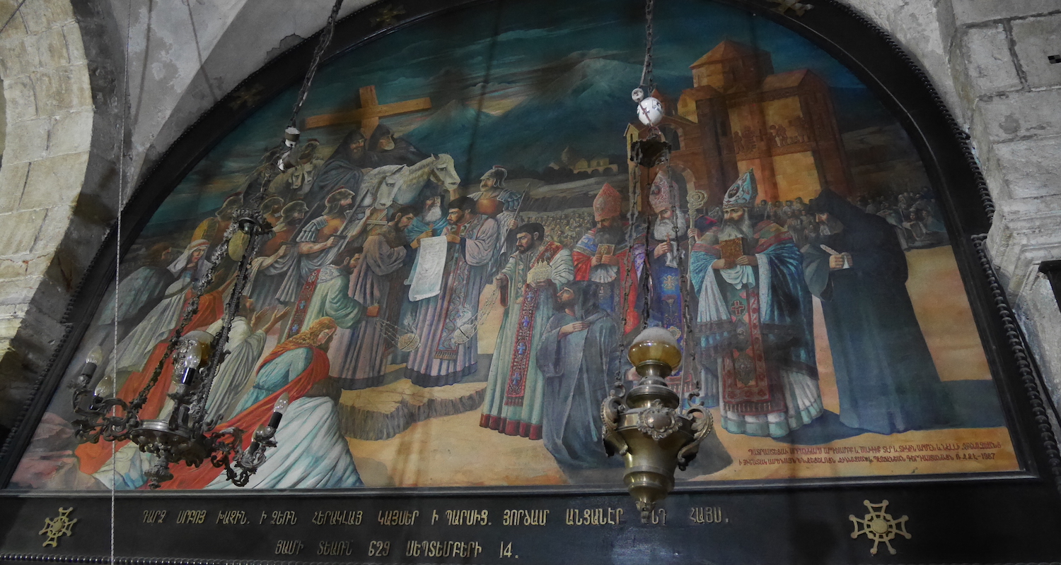 This mural on the south wall is fascinating. Note the stone church on the upper right that resembles the canopied altar structures of Helena and Demas. Several Armenian priests in black wear the peaked hat reminiscent of Mt. Ararat. Finally, in the background, the twin peaks of Greater and Lesser Ararat loom on the horizon.