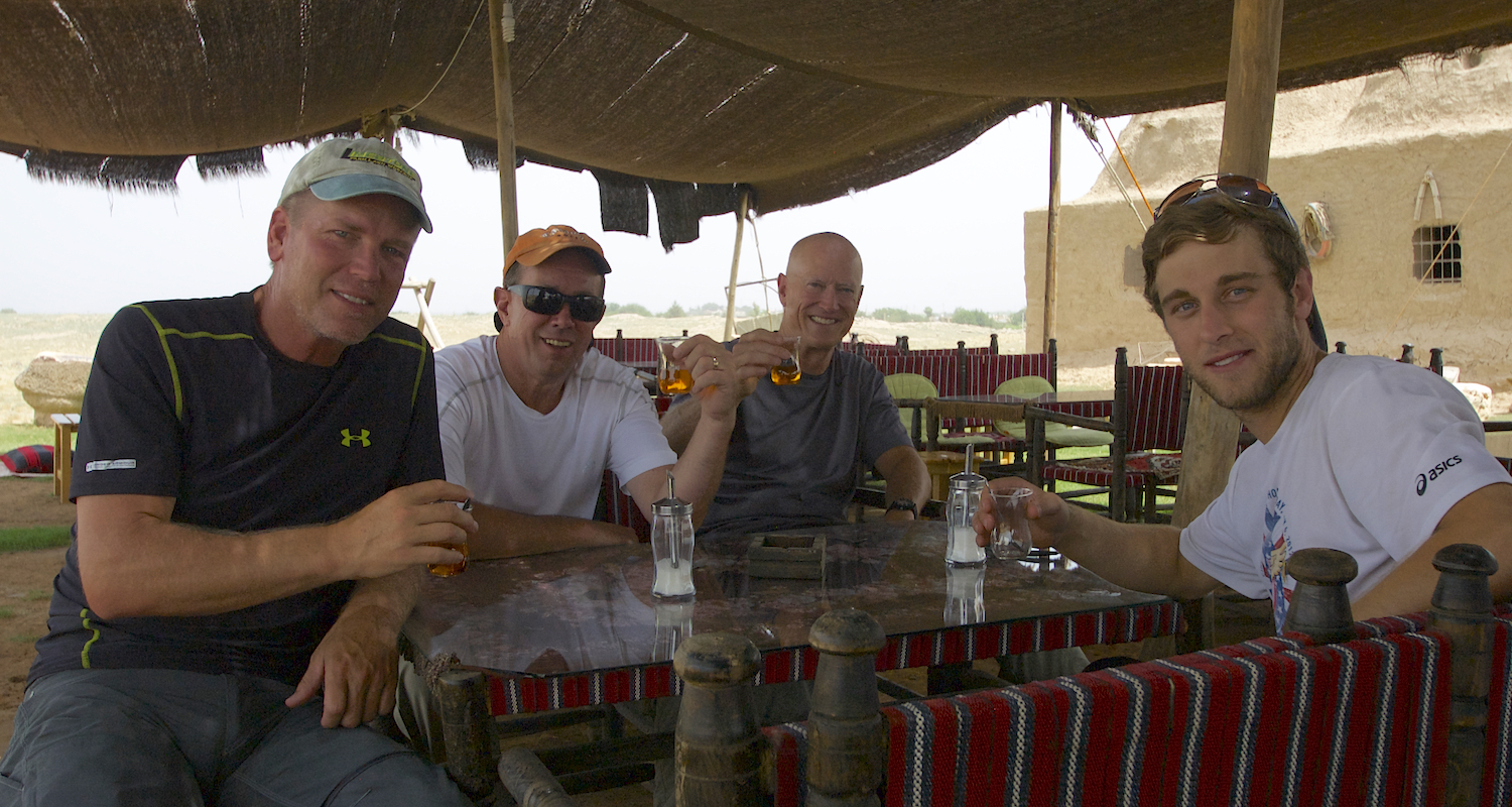 The boys sip apple tea, the ubiquitous drink of Turkey.