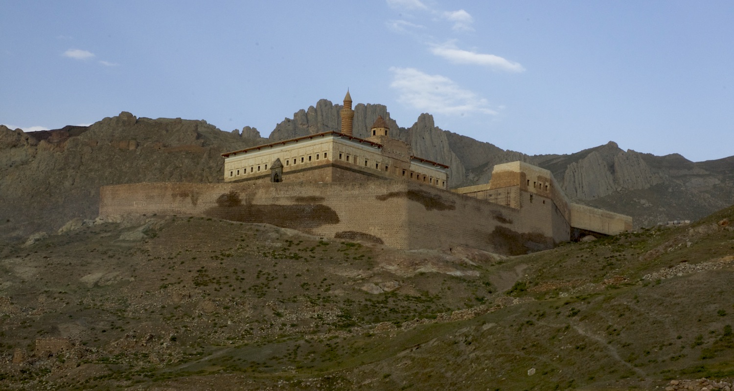 The palace squats on an elevated platform.