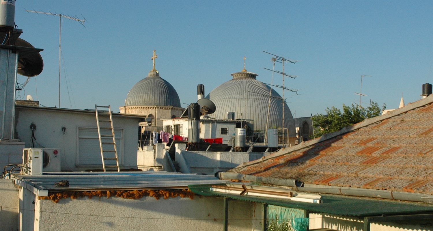 View from my roof to the twin domes of the Church of the Holy Sepulcher. It rises from the midst of despoiled humanity.