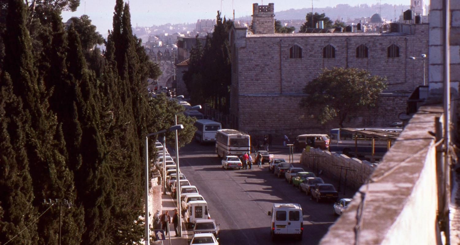 The view to the East Jerusalem Bus Station back in the day. Ecole Biblique is to the left, behind the trees. The Damascus Gate into the Old City is straight ahead.