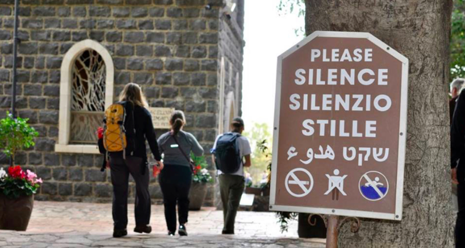 Signs call pilgrims to silent reflection.