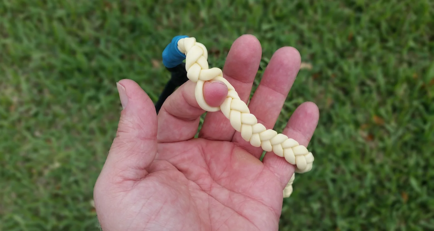 The nylon braid strangles my finger.