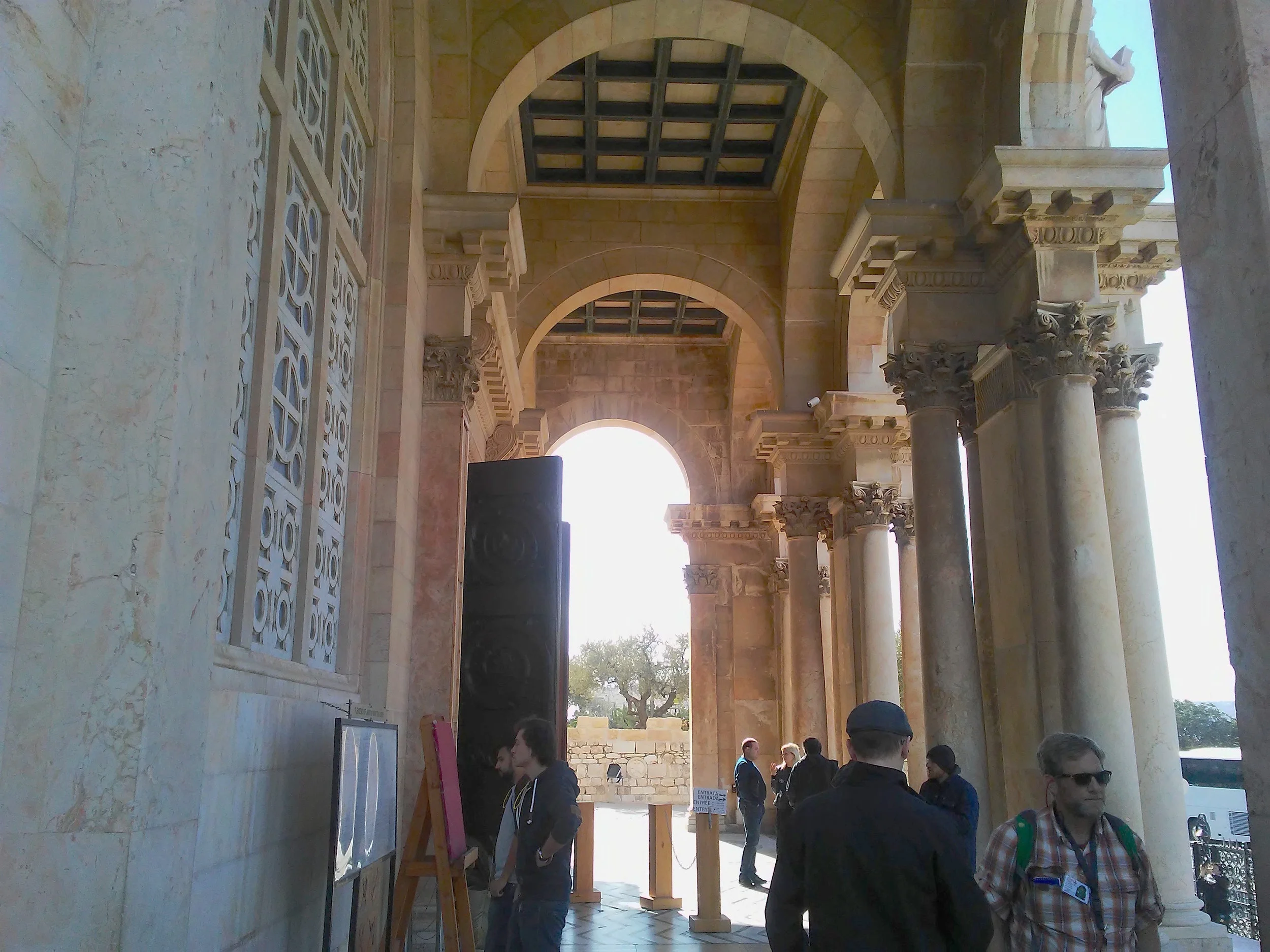The entrance to the Church of All Nations. Note the olive tree through the archway. Image by Robert Moses.