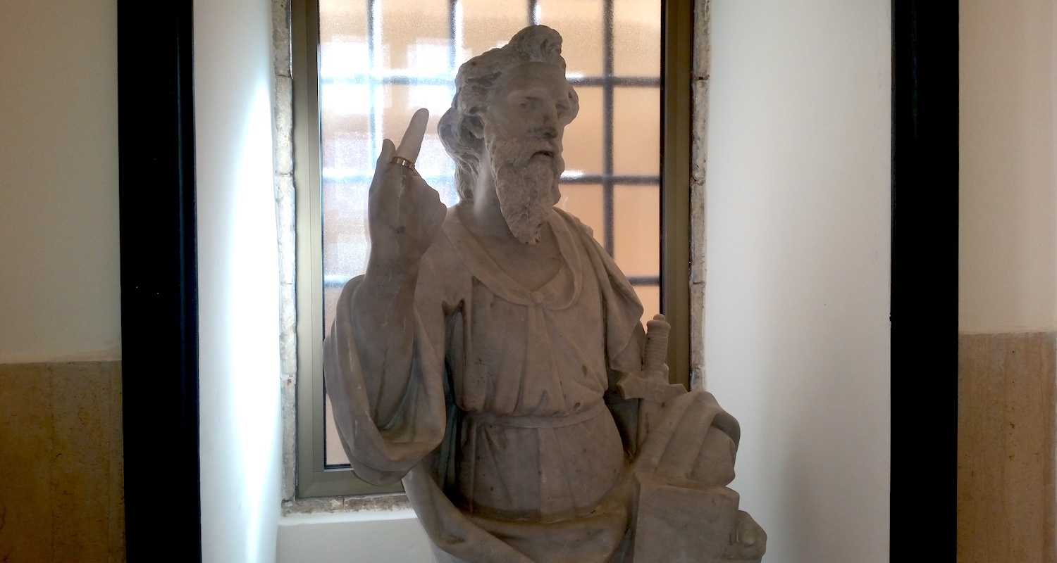 Peter-Paul bids pilgrims to enter. Mary is on the other side of the room.