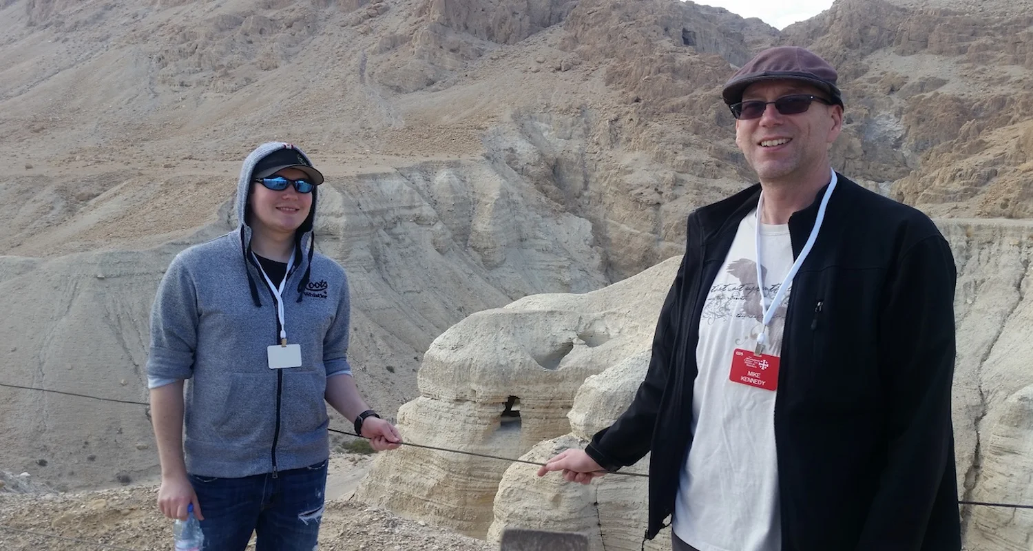 Mike with his son, Jimmy, visiting Qumran, Israel. Note the hand-hewn cave behind them. This is Cave 4, perhaps the most important of the Dead Sea scroll repositories.