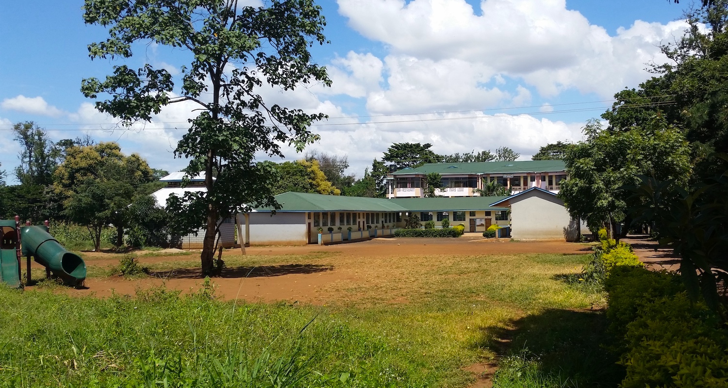 The schoolhouse is positioned between the lodge and the road.