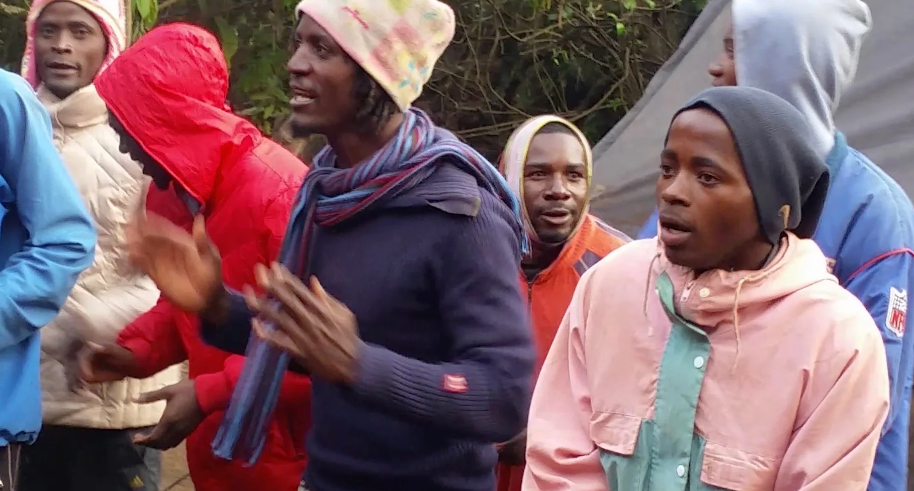 The Kandoo team was always ready to burst into song. Prosper Willium Mtui, in purple, claps and sings.