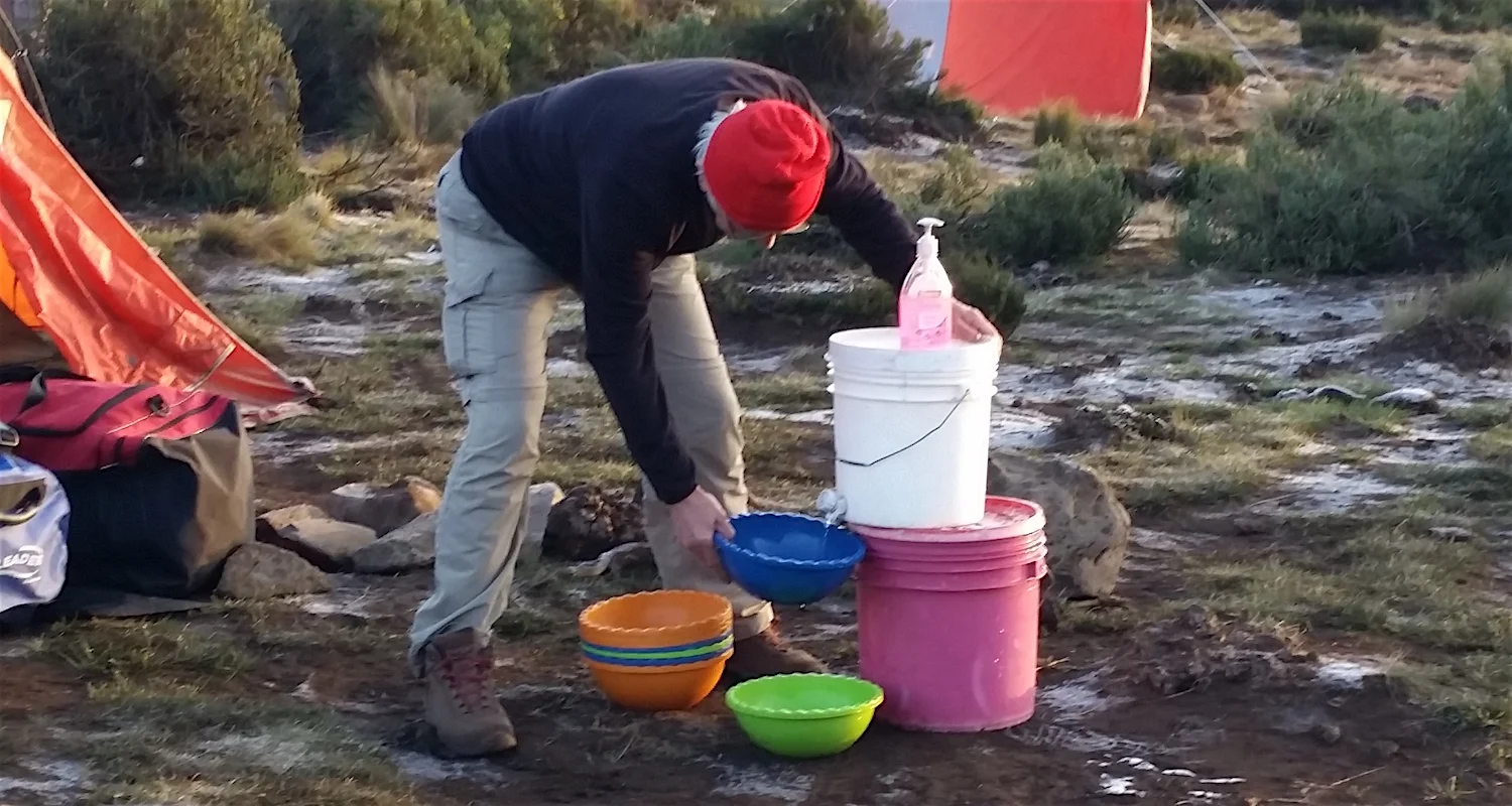 Yves does a quick morning wash with warm water.