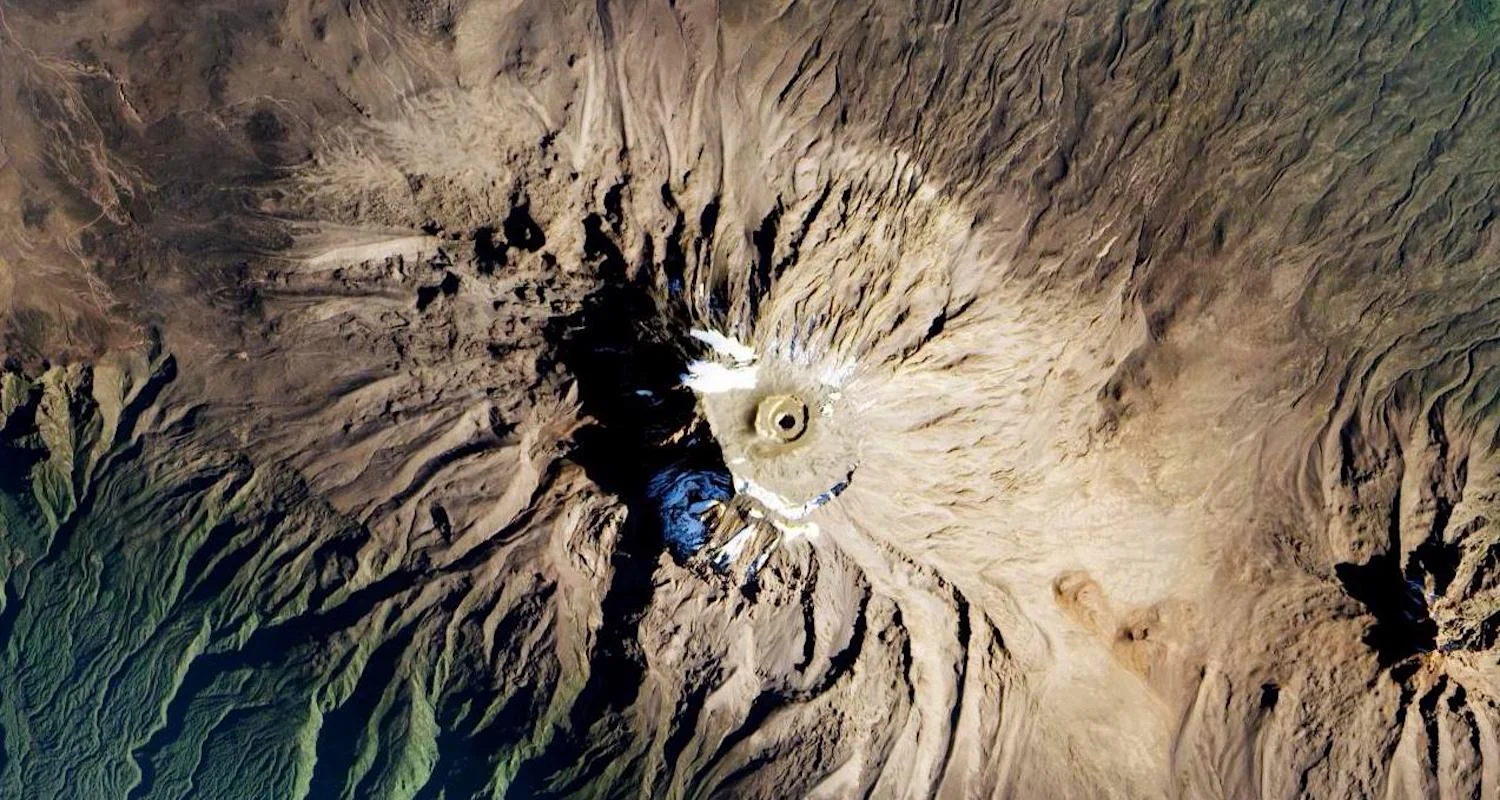 This view of Kibo from Nasa's EO-1’s Advanced Land Imager (ALI) was taken less than a year ago on Jan. 20, 2017. It offers a vertical view to Kibo's flattop. Mawenzi photobombs the shot in the lower right. Here is a link to this image accessed 12/31/17.