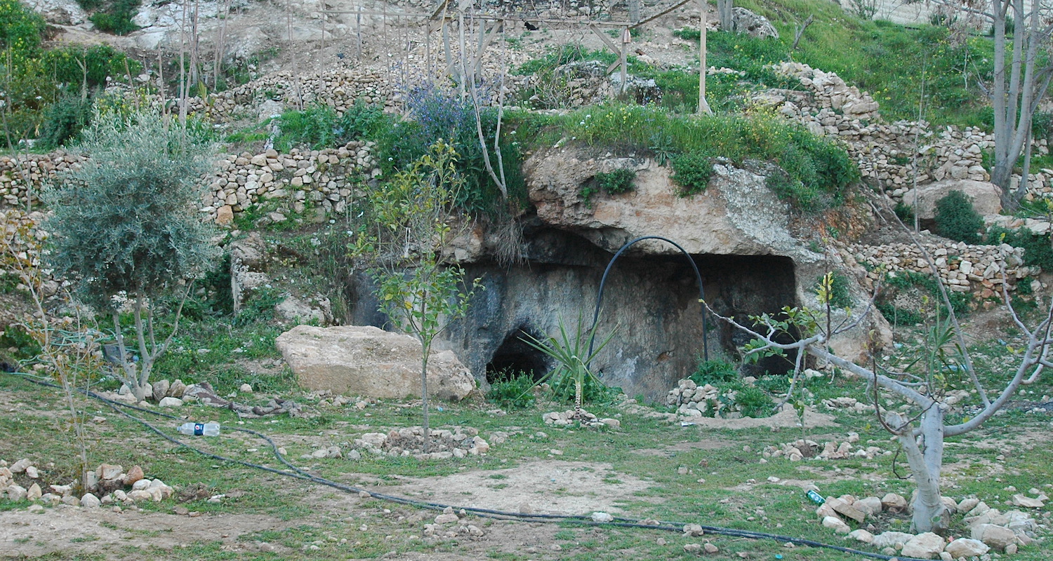 There are a number of Second Temple Period tombs in the lower reaches of the Hinnom Valley in Jerusalem. This one is in somebody's backyard.