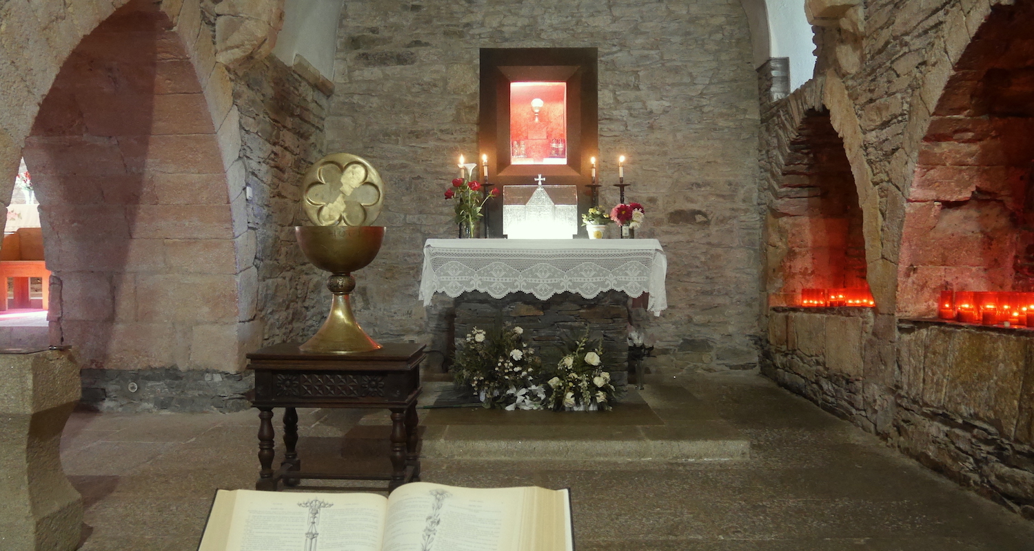 A view to the altar. Note the large model of a cup on a table.