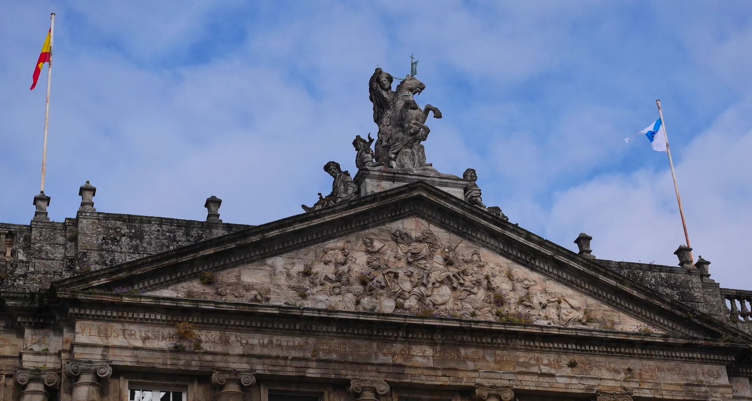 That is Santiago Matamoros riding high above the battle of Clavijo depicted on the pediment of the Palacio de Rajoy (or Pazo de Raxoi). You can see him glaring down (with sleepy eyes?) at the Plaza del Obradoiro in Santiago de Compostela. Once this …