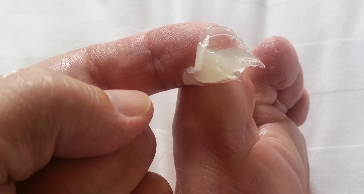 Petroleum jelly works magic on the piggies. It kept mine pink and soft and blister-free through 500 miles of walking.