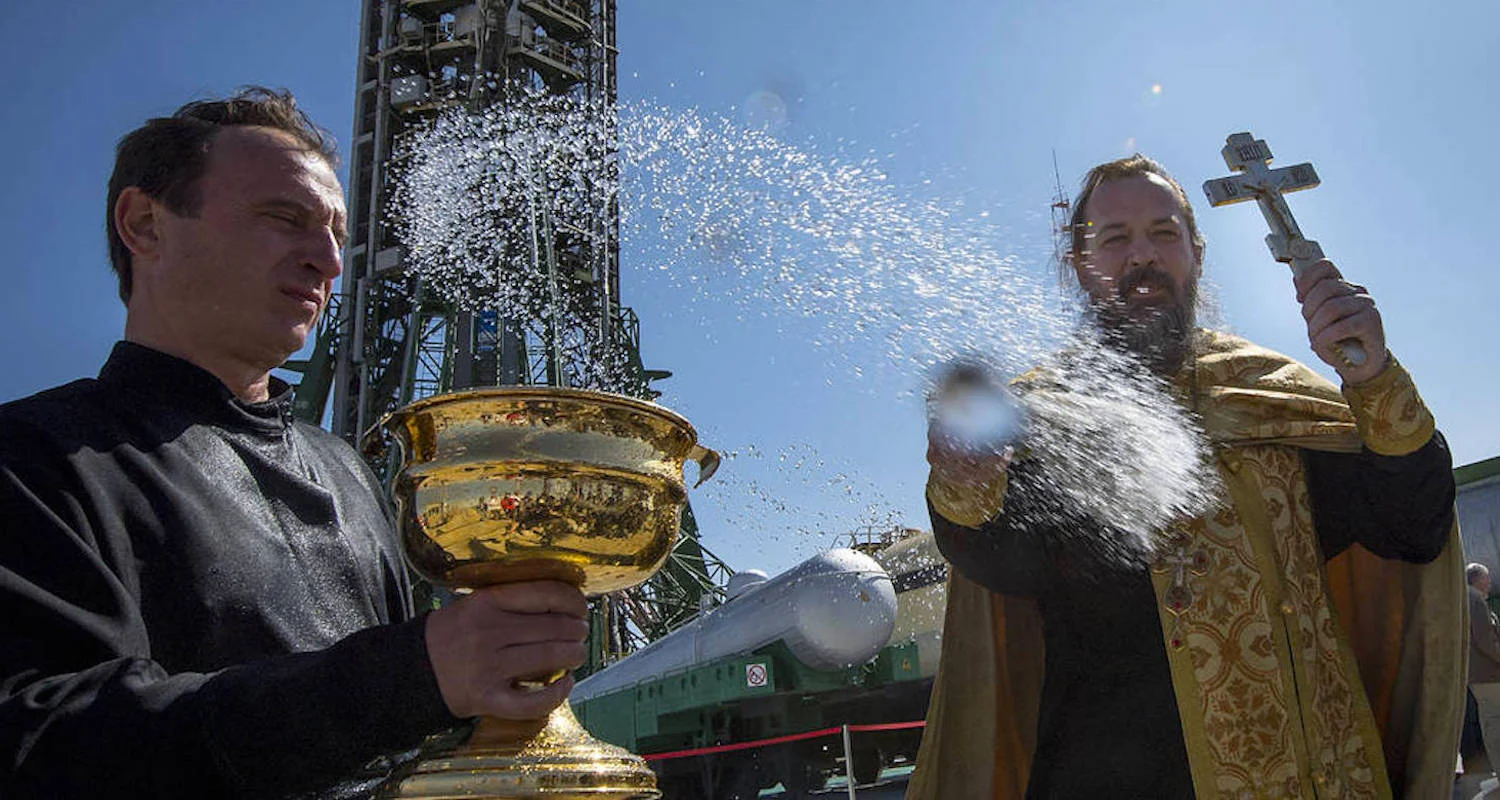 An Orthodox priest pronounces a blessing over the assembled media and a Soyuz rocket ready for a blast off. The Orthodox are not shy in dispensing blessings. This image is from here , accessed 12/22/2018.